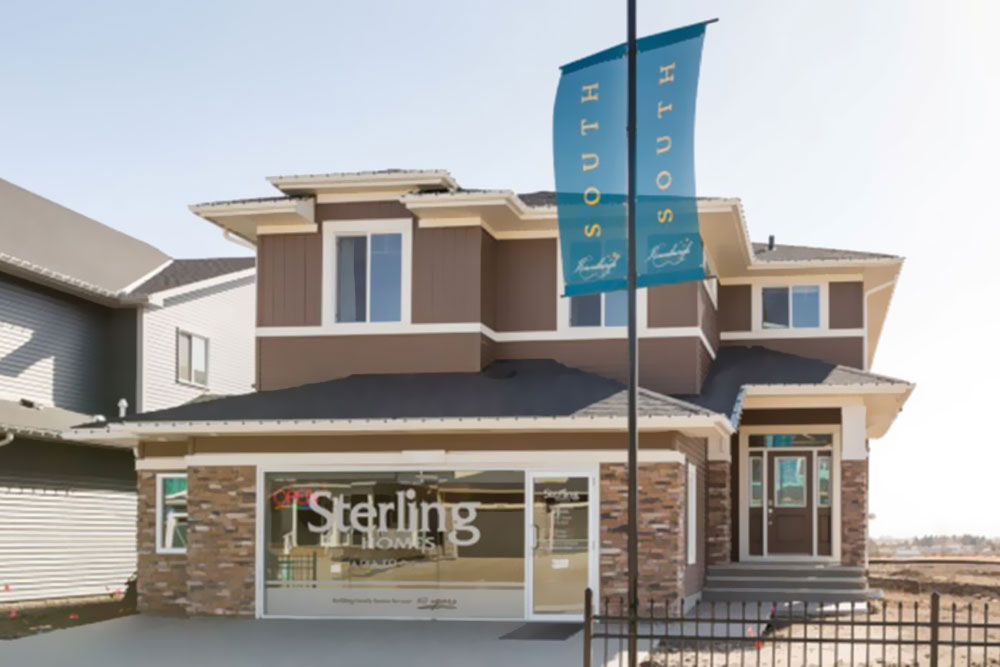 Road-side view of a Sterling Homes showhome in a new Chestermere community called South Kinniburgh